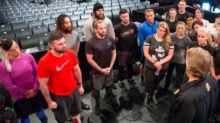 Prospective WWE talents listen to William Regal (bottom right)