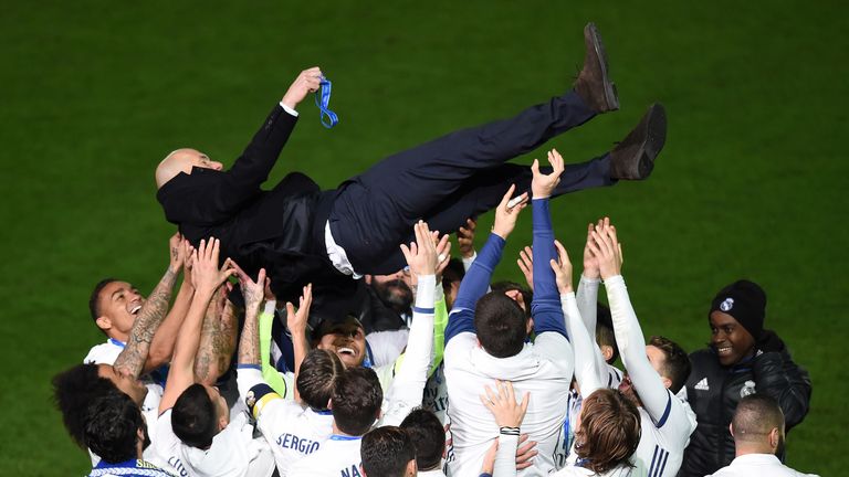 Zidane is thrown into the air by Real Madrid players after the presentation