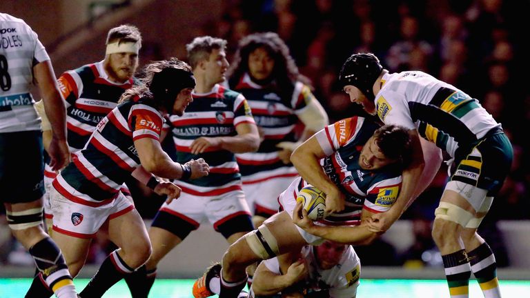 Ed Slater (second right) is brought to ground by James Craig (right) 