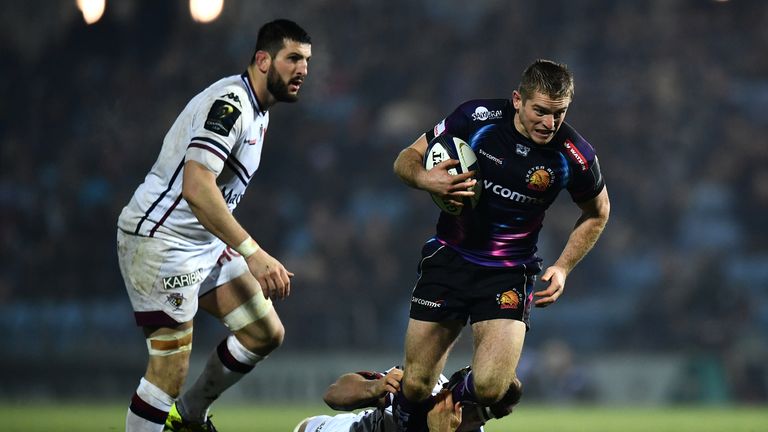 Exeter's Gareth Steenson of is tackled by Luke Jones 