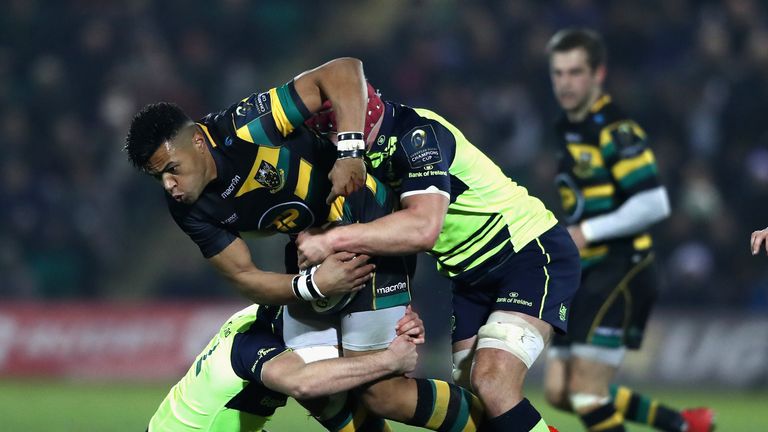 Luther Burrell is brought to ground by the Leinster defence