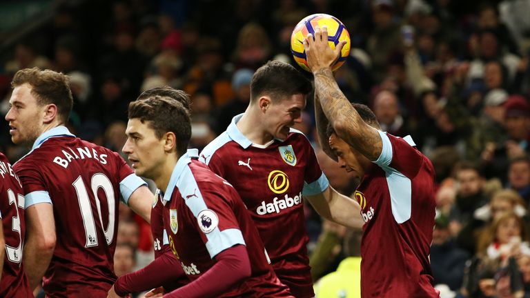Gray holds the match ball aloft after clinching his hat-trick