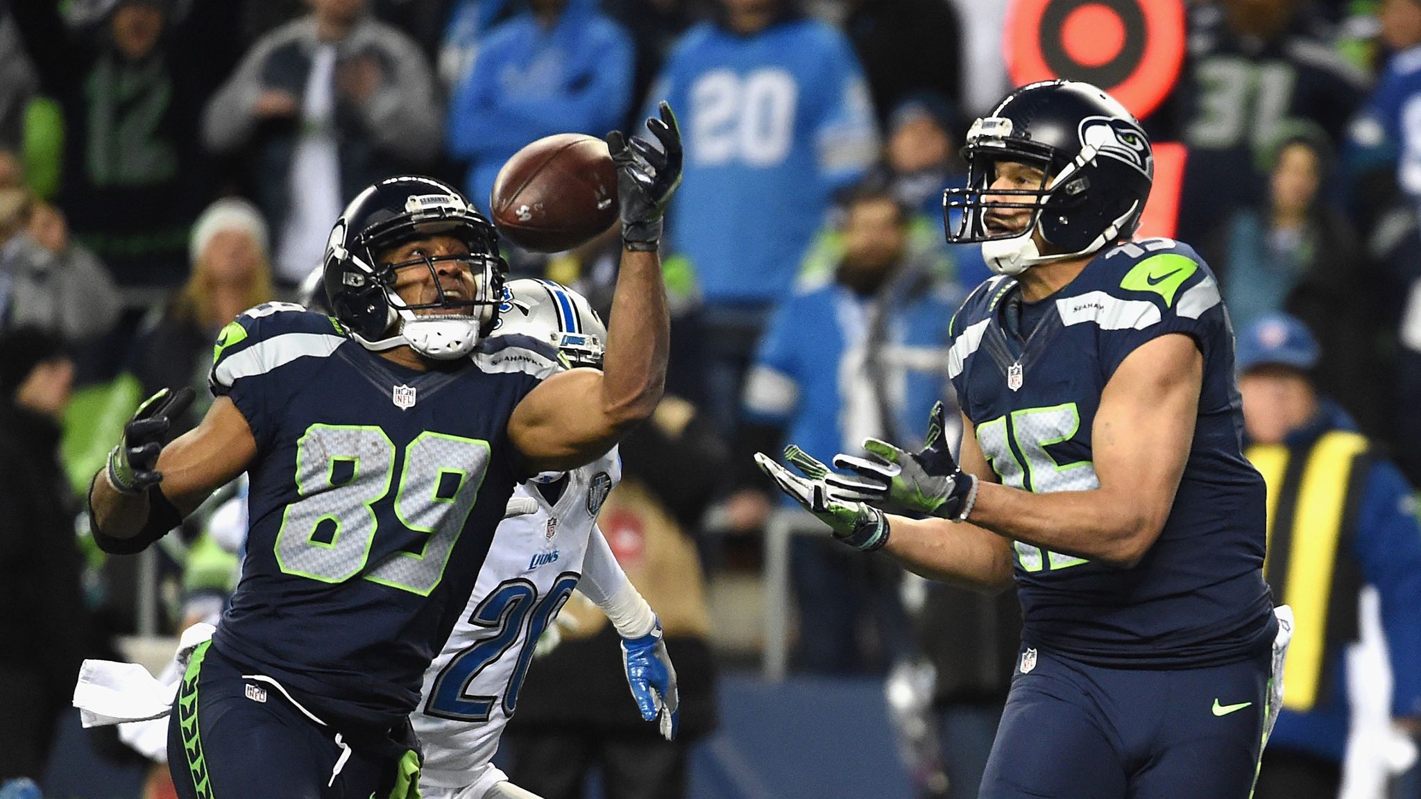 Seattle Seahawks head coach Pete Carroll and wide receiver Doug Baldwin  (89) watch a replay of a 42-yard catch he made in the fourth quarter of in  a Wild Card round game