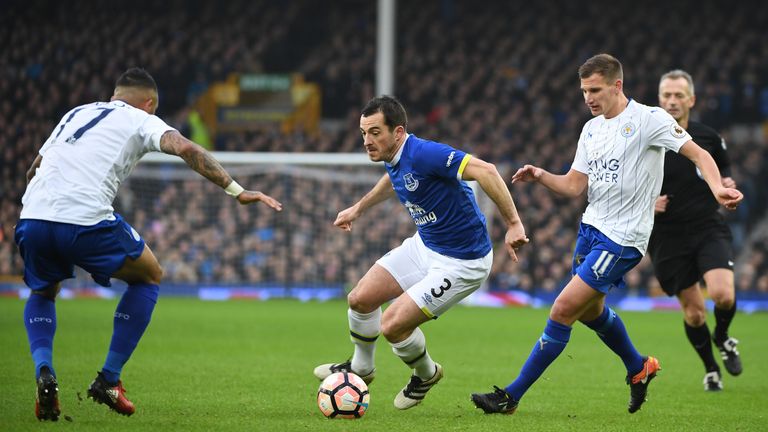 Everton's Leighton Baines (C) looks for a way through