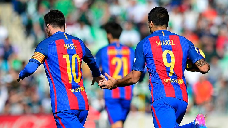 Lionel Messi (L) and Luis Suarez celebrate Barca's late equaliser at Real Betis