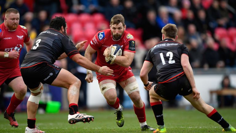 Scarlets number 8 John Barclay runs at the Saracens defence