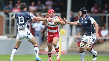 Steve McColl of Gloucester moves between Jon Clarke (L) and Ryan Burrows (R)