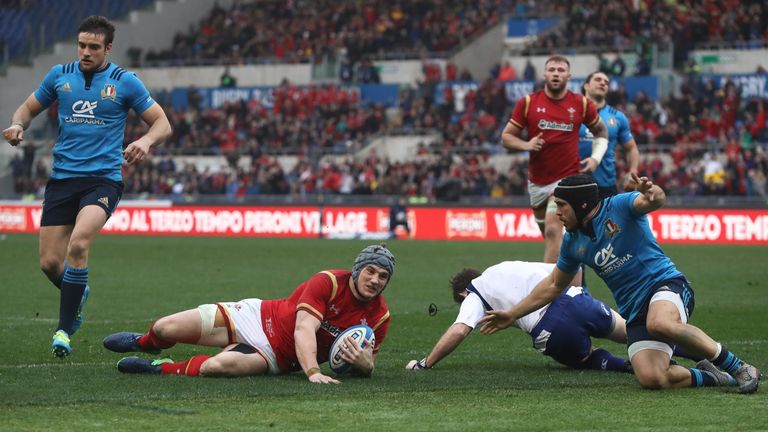 Jonathan Davies slides over to score Wales' first try