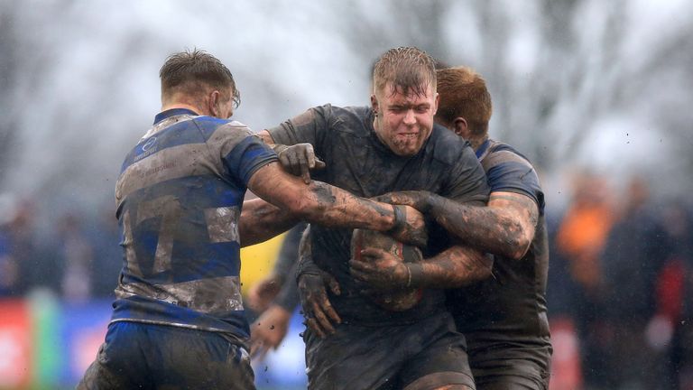 Iain Davies (left) tackles Toronto's Jack Bussey