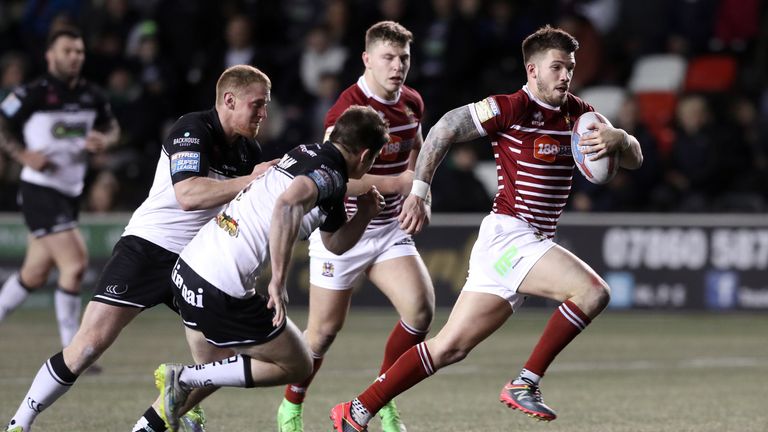 Oliver Gildart skips away from Widnes' Charly Runciman to score