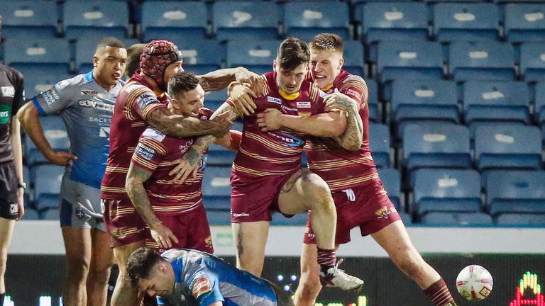 Oliver Roberts (2nd right) is congratulated after scoring against Wakefield