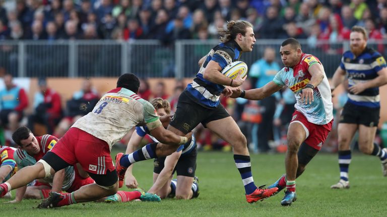 Max Clark makes a break to score against Harlequins