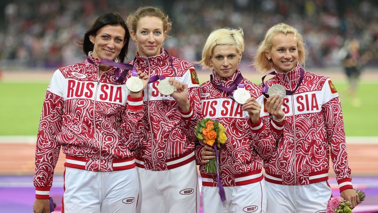 Silver medalists Yulia Gushchina, Antonina Krivoshapka, Tatyana Firova, Natalya Antyukh of Russia pose on the podium
