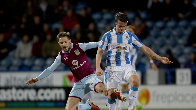 Aston Villa's James Bree tackles Huddersfield Town's Jonathan Hogg