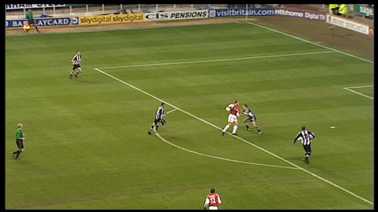 Bergkamp flicks the ball around Newcastle's Nikos Dabizas