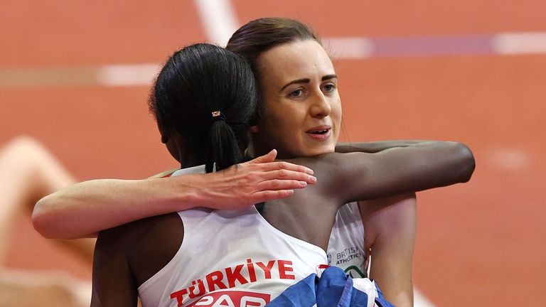 Laura Muir hugs Yasemin Can after winning the women's 3,000m