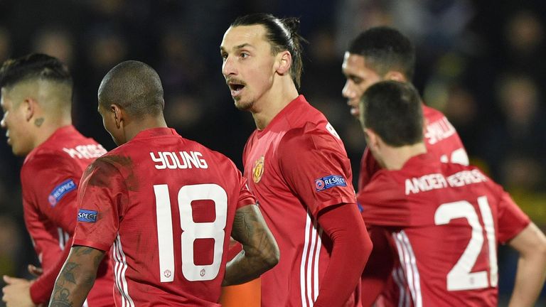 Man Utd's players celebrate opening the scoring at the Olimp-2 stadium