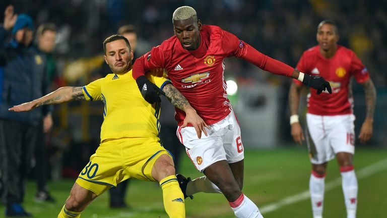 Manchester United midfielder Paul Pogba (right) battles for possession with Rostov'defender Fedor Kudryashov