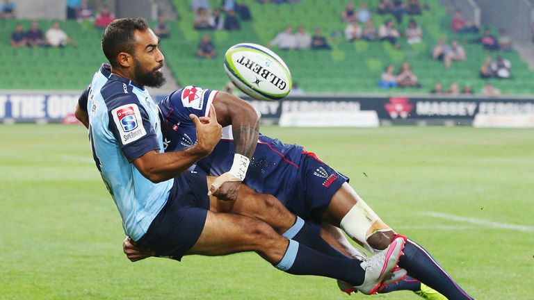 Waratahs wing Reece Robinson is tackled by Sefanaia Naivalu