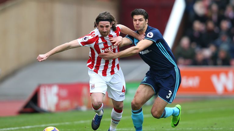 Joe Allen and Kevin Friend tussle at the bet365 Stadium
