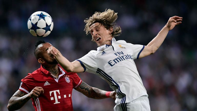 Arturo Vidal (left) vies with Real Madrid midfielder Luka Modric