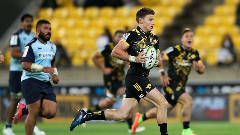 Beauden Barrett makes a break against the Waratahs