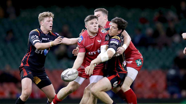 Steffan Evans looks to offload the ball during the derby encounter at the Principality Stadium