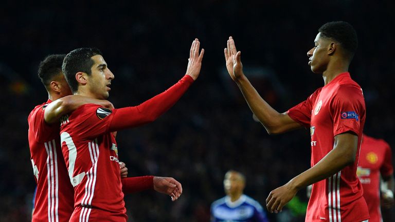 Henrikh Mkhitaryan celebrates with team-mates after the opener
