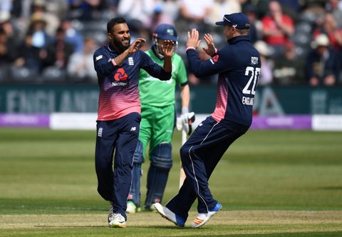 England's Adil Rashid celebrates after dismissing Ireland's Stuart Thompson