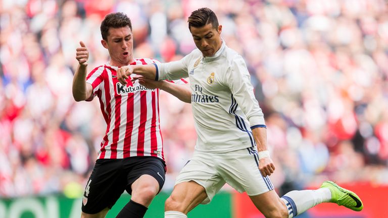 Aymeric Laporte challenges Real Madrid's Cristiano Ronaldo
