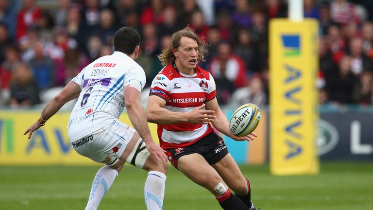 Billy Twelvetrees passes the ball as Dave Dennis looks on