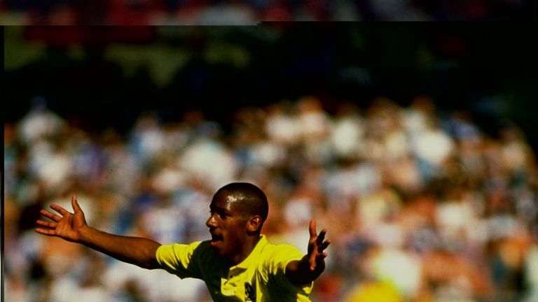 Dion Dublin celebrates scoring for Cambridge