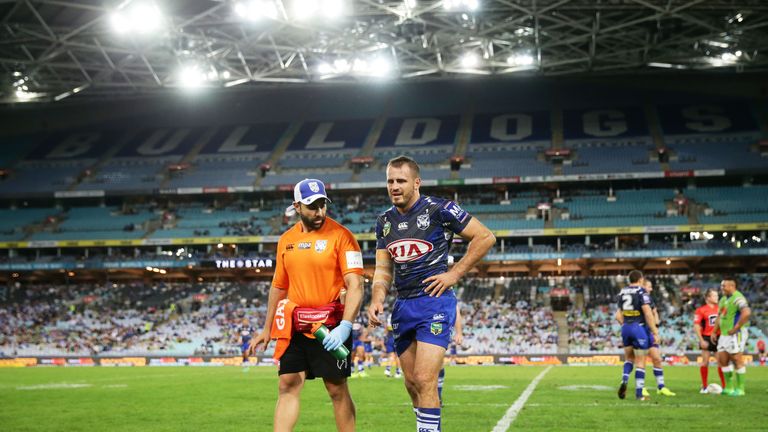 Josh Reynolds of the Bulldogs leaves the field with an injury
