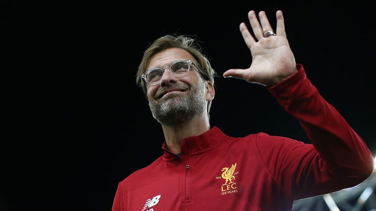 Liverpool manager Jurgen Klopp waves to fans