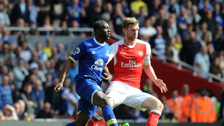 Per Mertesacker (R) could start for Arsenal