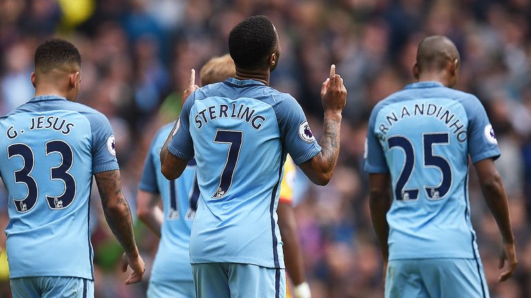 Raheem Sterling celebrates after scoring Man City's fourth