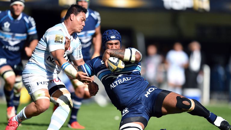 Montpellier winger Nemani Nadolo is tackled by Racing No 8 Chris Masoe