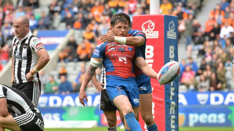 Scott Grix celebrates after scoring his first try against former club Widnes