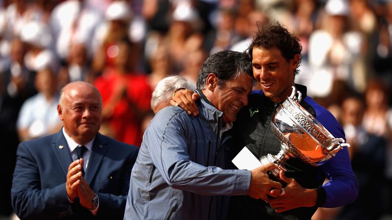 Nadal celebrates with his uncle and coach Toni Nadal