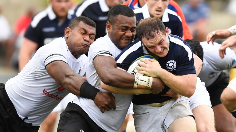 Nick Grigg is tackled by Fiji's Kini Murimurivalu