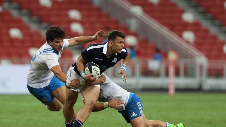 Scotland's Damien Hoyland runs with the ball 