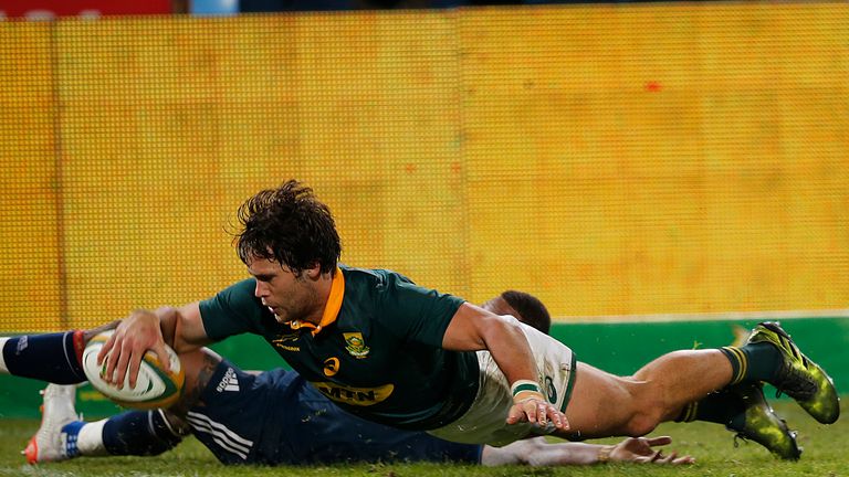 South Africa's Jan Serfontein goes over