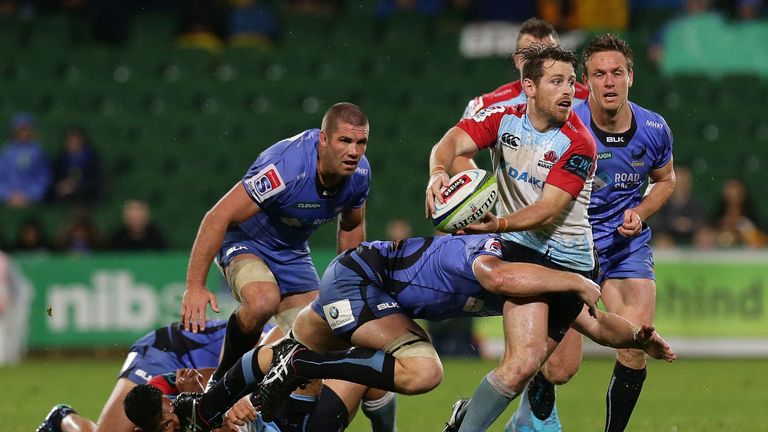 Waratahs fly-half Bernard Foley looks to pass the ball