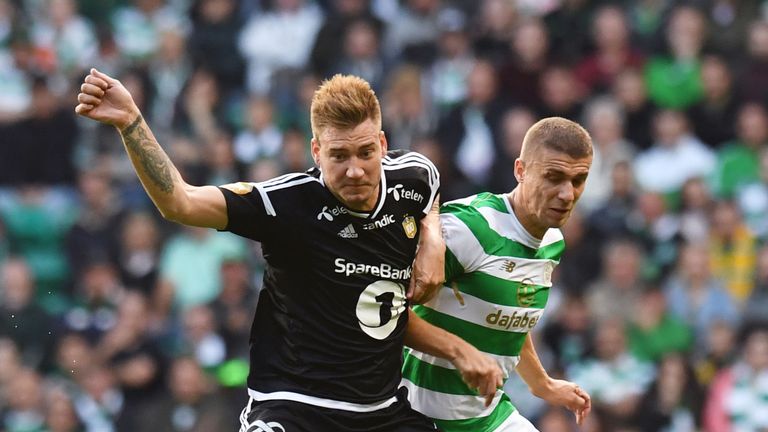 Rosenborg's Nicklas Bendtner (left) battles for possession with Celtic's Jozo Simunovic at Parkhead