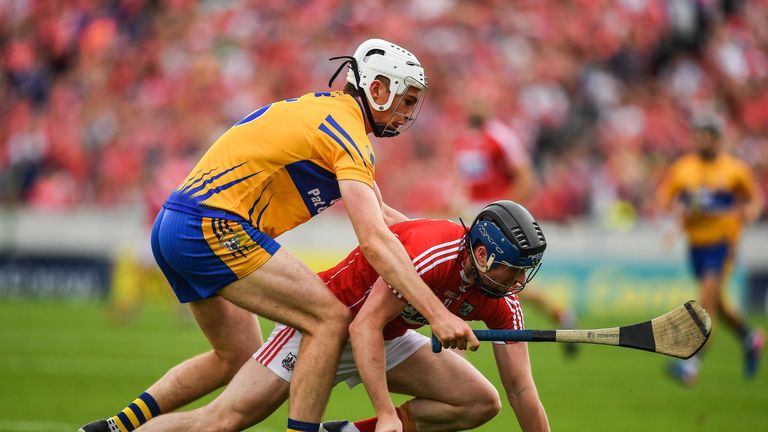 Conor Lehane of Cork is crowded out by Clare's Connor O'Leary 