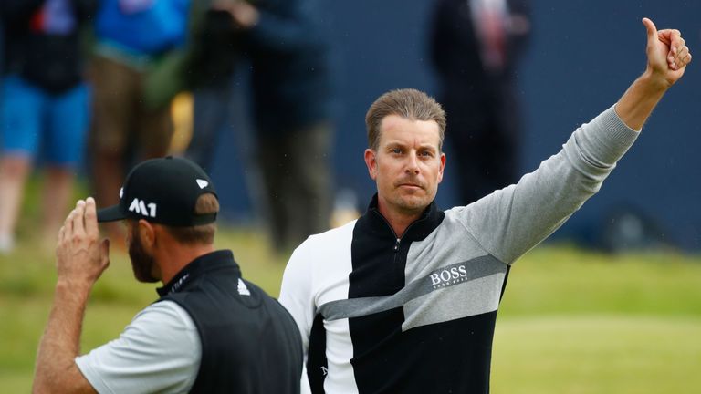 Stenson and Dustin Johnson acknowledge the crowd on the 18th hole at Royal Birkdale