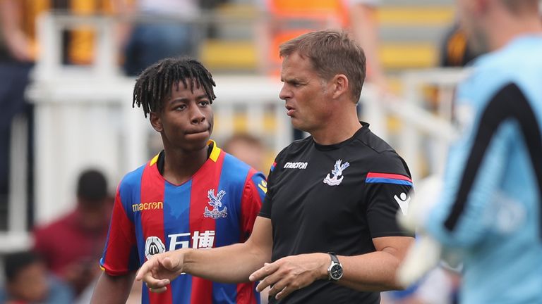 De Boer gives instructions to Jason Lokilo during a pre-season game at Maidstone