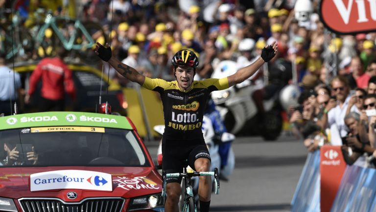 Slovenia's Primoz Roglic celebrates as he crosses the finish line