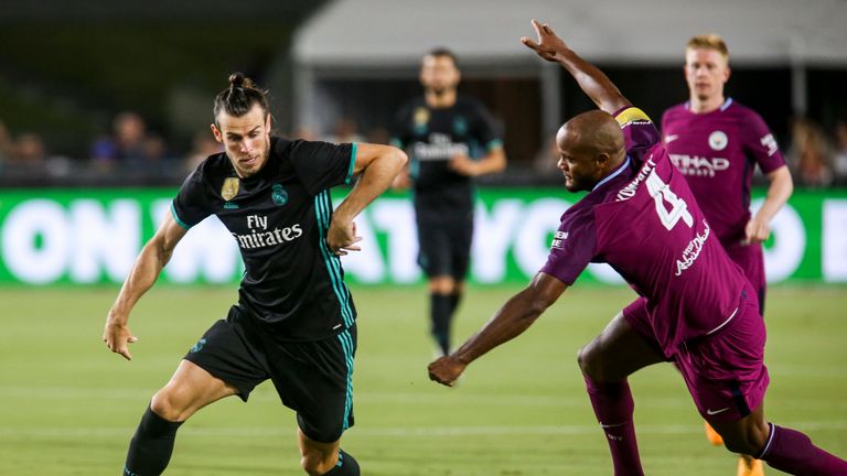 Gareth Bale gets past Vincent Kompany in the first half in LA