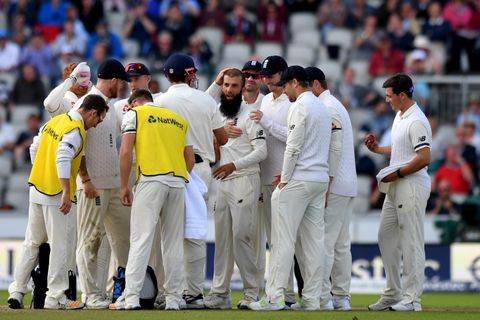 Moeen Ali is congratulated following a successful review for the wicket of Hashim Amla